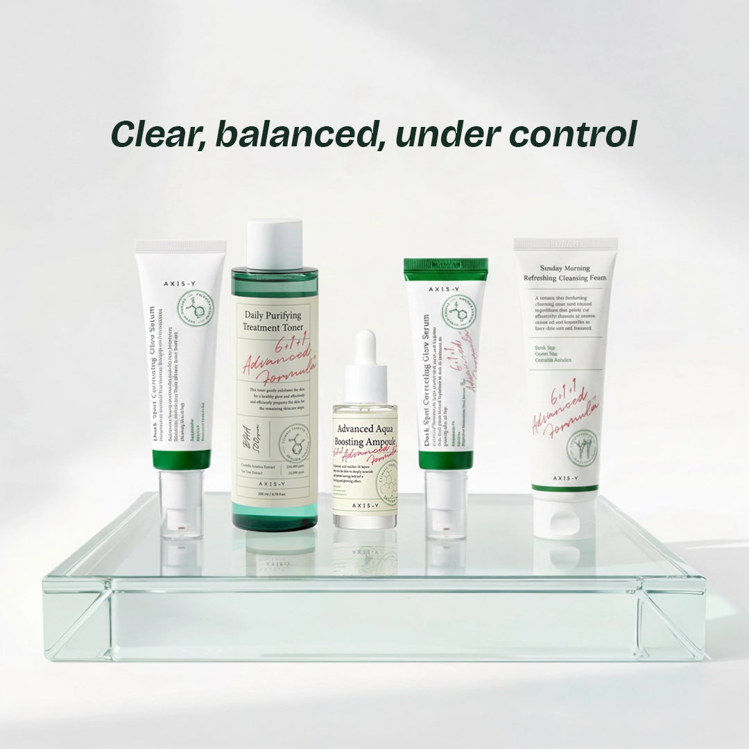Full AXIS-Y 5-step routine — BHA toning, aqua ampoule hydration, dark spot correction, and gentle foam cleansing with centella and tea tree.